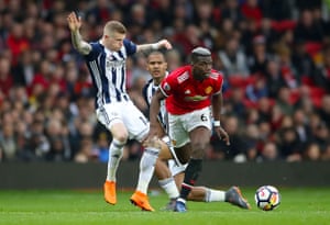 McClean goes over after a push from Pogba.