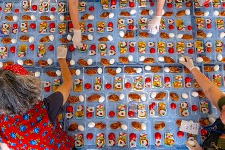 Aerial shot of food being divided into portions for handing out.