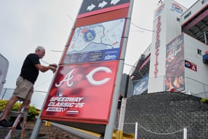 Rod Bruchell installs signs outside Bristol Motor Speedway on Friday, the day before the MLB Speedway Classic.