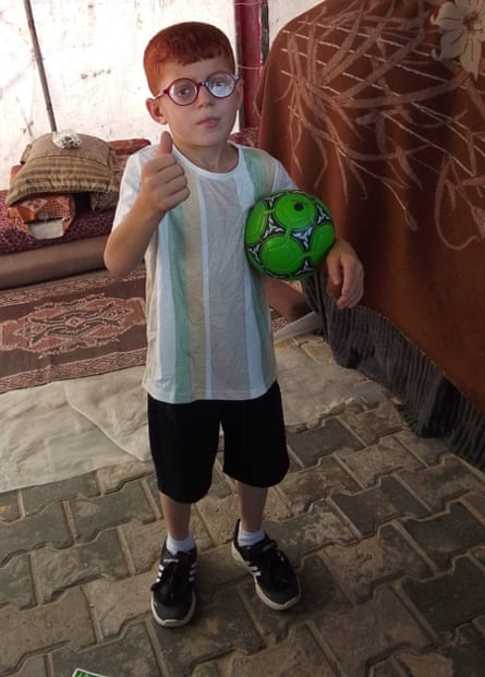 Ayoub gives a thumbs up while wearing his new glasses.