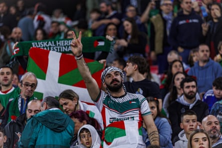 Fans show their support for the away side.