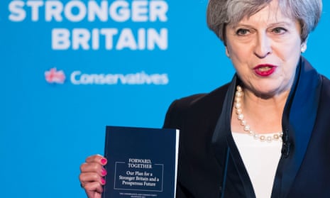 Theresa May with manifesto
