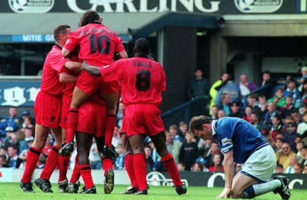 Captain Dave Watson drops to his knees as Everton concede a second.