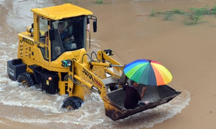 China Henan Xinxiang Rainfall Rescue - 22 Jul 2021Mandatory Credit: Photo by Xinhua/REX/Shutterstock (12226221b) Staff members drive a shovel loader to help a local resident to evacuate from Huangzhuang Village in Weihui of Xinxiang, central China’s Henan Province, July 22, 2021. Over 500 local residents have so far been evacuated from Xinxiang’s Huangzhuang Village as torrential rain hit a number of cities in Henan Province including Xinxiang recently. China Henan Xinxiang Rainfall Rescue - 22 Jul 2021