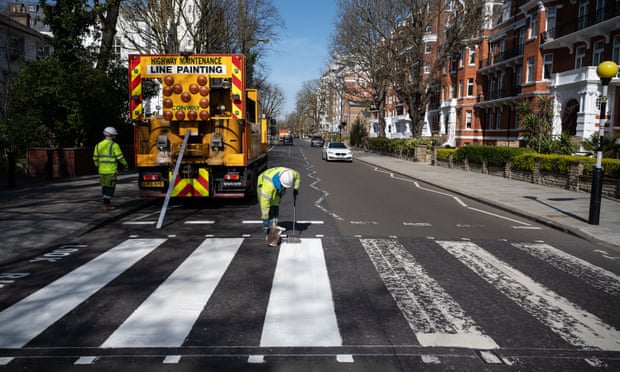 Iconic ... a maintenance team repaints the crossing on 24 March.