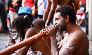 A street performer plays a didgeridoo in Sydney.