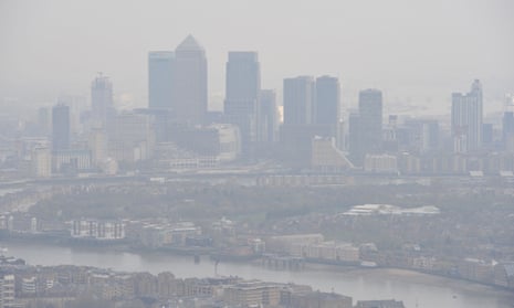 aerial shot of london covered with smog