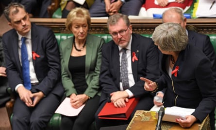 Smith (far left), listens as Theresa May speaks during PMQs.