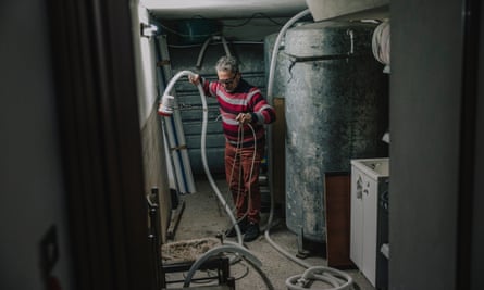 Salvatore Giamblanco, 66, preparing to fill the water tank of his bed and breakfast in Troina.