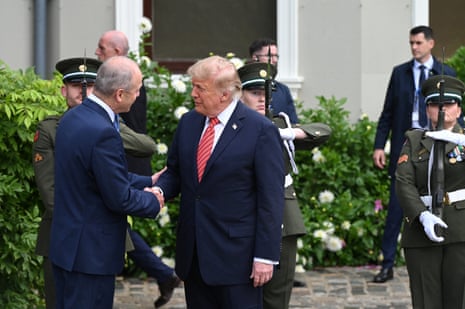 Donald Trump shakes hands with Micheál Martin.