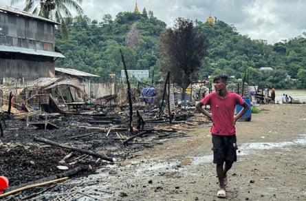 A man walks past the ruins of a building after an airstrike by Myanmar’s military in Kyauktaw, western Rakhine State on June 18, 2026