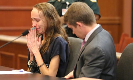 Heather Hironimus breaks down as she signs consent for her four-year-old son to be circumcised on 22 May at the South County courthouse in Delray Beach, Florida.