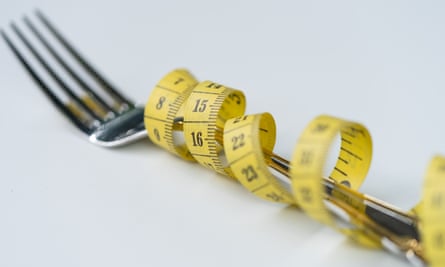 A fork with a tape measure