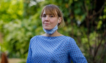 Woman with mask as chin-strap