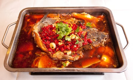 Whole roasted sea bass in chillis and oil