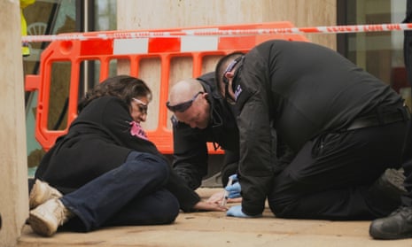 Police officers unglue lawyer Farhana Yamin from the pavement outside Shell’s London HQ, 2019.