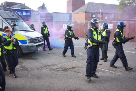 Police officers on guard outside the Bell hotel in Epping, Essex