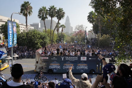 Los Angeles Dodgers players wave to fans during the team's victory parade.