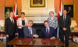 Theresa May stands with first secretary of state Damian Green, while DUP leader Arlene Foster stands with DUP deputy leader Nigel Dodds, as DUP MP Jeffrey Donaldson (in glasses) shakes hands with parliamentary secretary to the Treasury Gavin Williamson inside 10 Downing Street on Monday