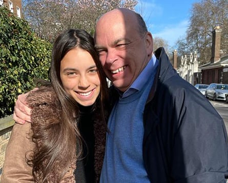 Mike Lynch and his daughter Hannah smile as they hug each other