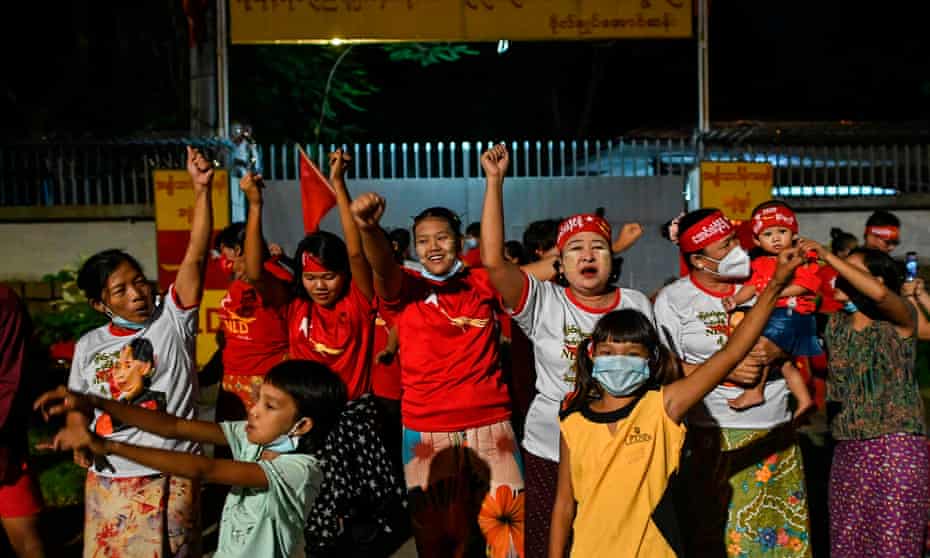 Supporters of the National League for Democracy (NLD) party celebrate in front of the Aung San Suu Kyi’s house in Yangon 