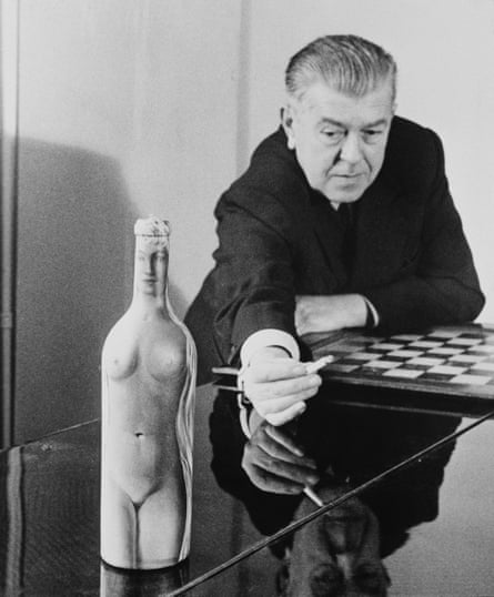 Rene Magritte with ‘Femme-Bouteille’, his oil painting of a nude on a glass bottle, circa 1955.