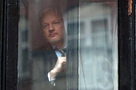 WikiLeaks founder Julian Assange prepares to speak from the balcony of the Ecuadorian embassy