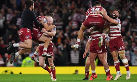 Wigan Warriors celebrate after beating Catalan Dragons to win their sixth Super League Grand Final at Old Trafford in Manchester