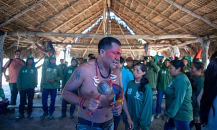 Forest Guardians leader Olímpio Iwyramu Guajajara performs a traditional song to welcome the Javari activists