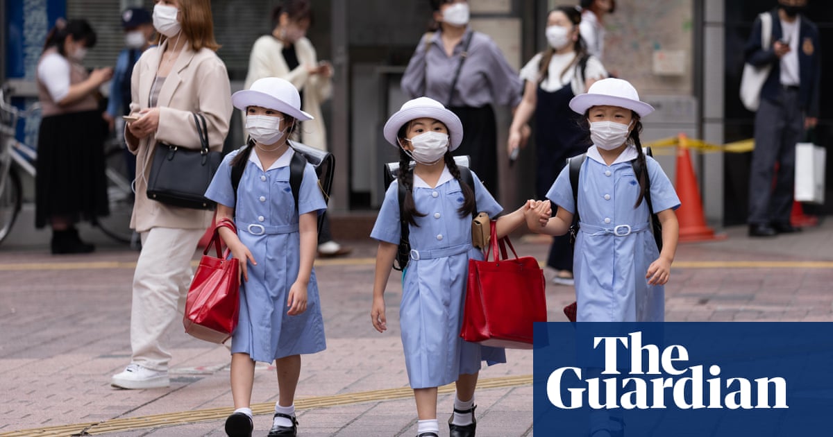 Japanese children allowed to talk again over lunch as Covid cases fall