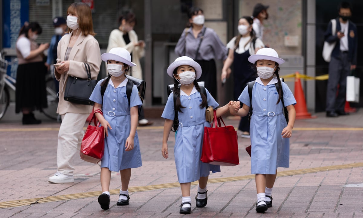 Japanese children allowed to talk again over lunch as Covid cases fall |  Japan | The Guardian
