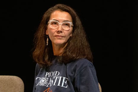 Mary Peltola seated on a debate stage