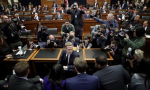 Mark Zuckerberg confers with members of his team on Capitol Hill Wednesday in Washington DC.