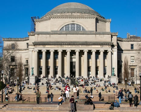 Students sit on the front steps of Low Memorial Library on the Columbia University campus in New York City in 2023.
