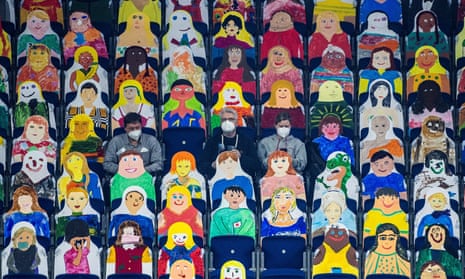 Spectators wear face masks as they sit amidst carboard cut-outs during the ISTAF indoor athletics meeting in Berlin, Germany.