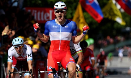 Arnaud Demare celebrates as he crosses the finish line to win stage four of Le Tour de France.