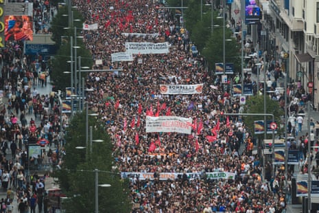Demonstrators gather in Madrid's city center during a housing rights demonstration outside Madrid City Hall in Madrid, Spain.