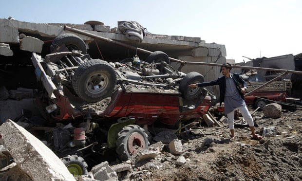 A man shows damage at a house believed to have been destroyed by a Saudi-led airstrike in the Yemeni capital, Sana’a