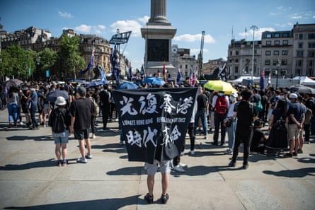 Protesters attend a rally for democracy in Hong Kong in Trafalgar Square in London on 12 June 2021.
