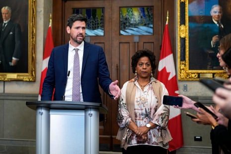 People stand at lectern