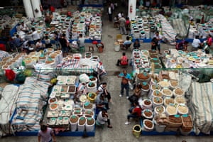 Traders wait for customers at a traditional Chinese medicine market in Bozhou, Anhui province, China.