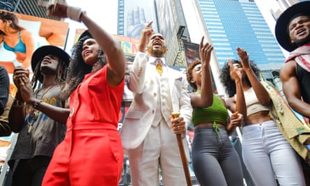 Janelle Monáe (in red) and members of Wondaland chant the names of black Americans killed by US police in the Protest song Hell You Talmbout.