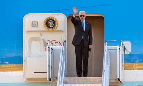 Joe Biden waves from Air Force One after the US-Russia summit with Vladimir Putin on 16 June 2021.
