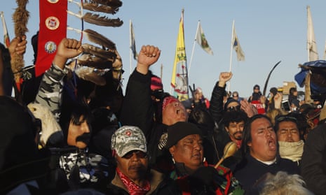 Native American “water protectors” celebrate that the Army Corps of Engineers has denied an easement for the $3.8 billion Dakota Access Pipeline, inside of the Oceti Sakowin camp, near Cannon Ball, North Dakota, U.S., December 4, 2016. 