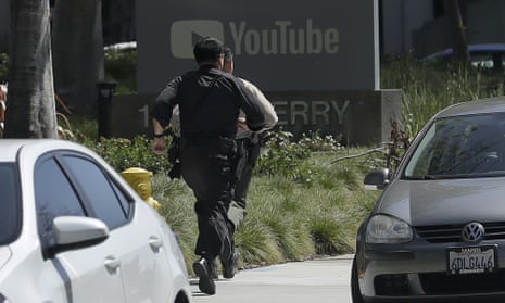 Officers run toward a YouTube office in San Bruno, Calif., Tuesday, April 3, 2018. Police say they’re responding to an active shooter at YouTube headquarters. (AP Photo/Jeff Chiu)