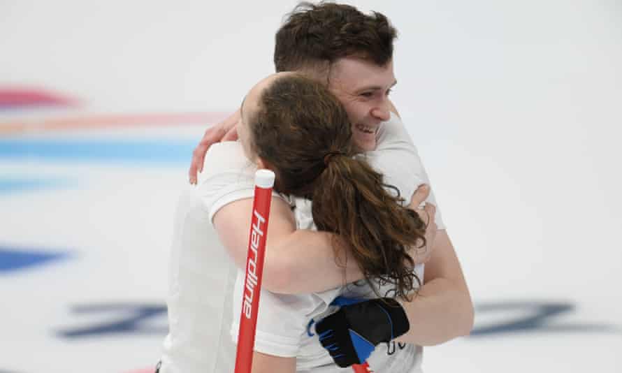 Bruce Mouat and Jennifer Dodds embrace after their close victory over Sweden at the Ice Cube