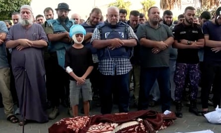 Al Jazeera correspondent Wael al-Dahdouh attends the funeral of his wife and children, who the network said were killed in an Israeli air strike in October.