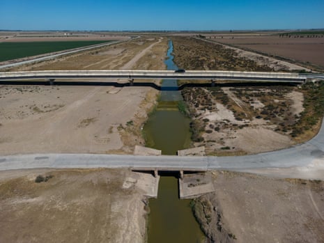 An irrigation canal in Spain’s Andalusia region lies nearly empty, after extreme heatwaves.