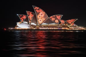 Sydney, Australia. Poppies are projected onto the sails of the Sydney Opera House as a mark of respect on Remembrance Day