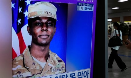 A TV screen shows an image of US soldier Travis King during a news program at the Seoul railway station in South Korea.